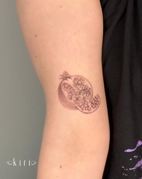 Fine line pomegranate tattoo by @kiri.vrs