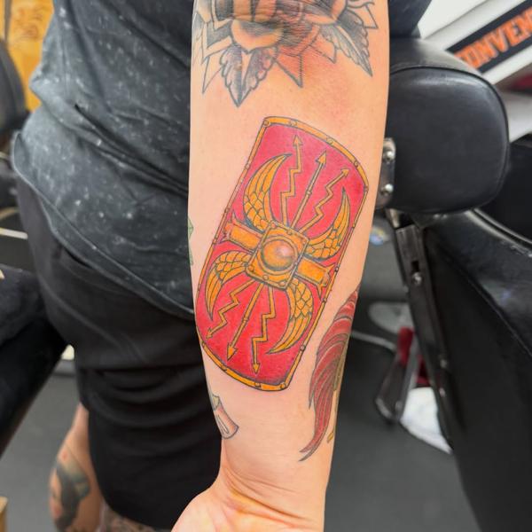 Traditional roman shield tattoo by @lalhardy