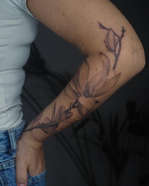 Fine line magnolia flower tattoo by @lionoflauratattoos