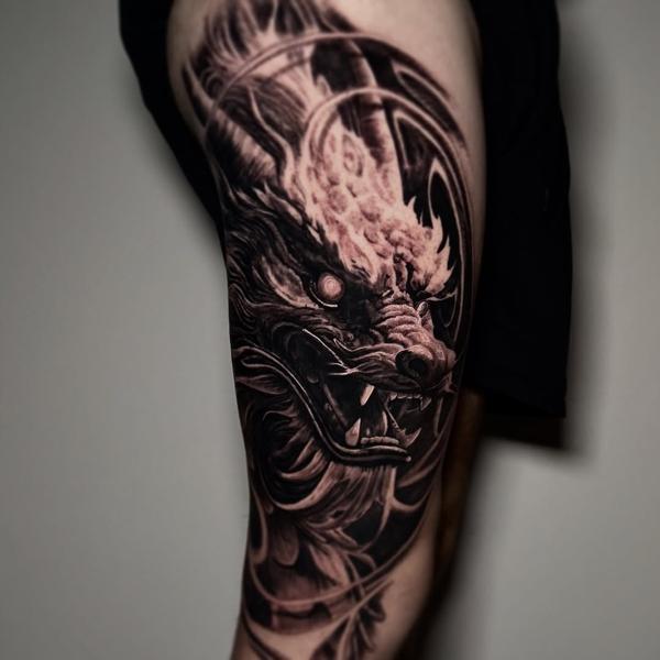 Realism dragon head tattoo by @lazaros_brone