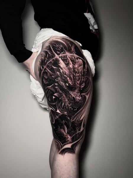 Realism dragon head tattoo by @lazaros_brone