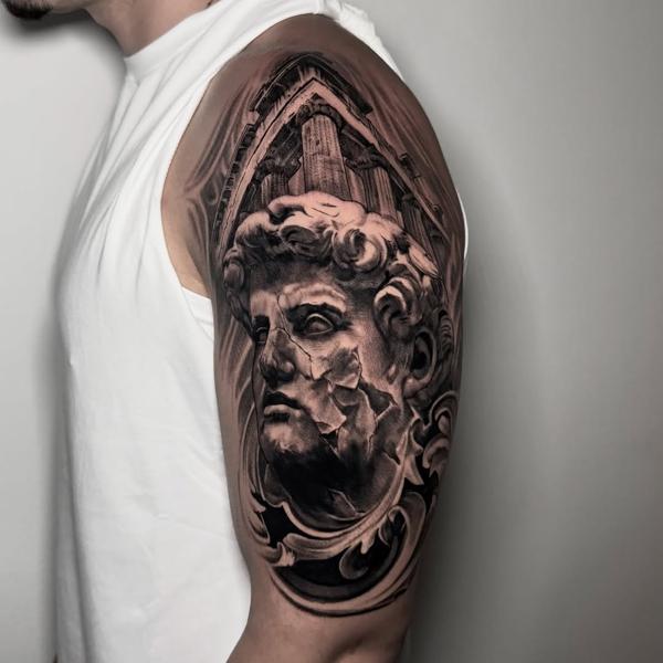 Realism classical statue tattoo by @lazaros_brone