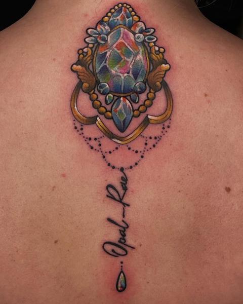 Realism ornate gemstone tattoo by @leahmoule