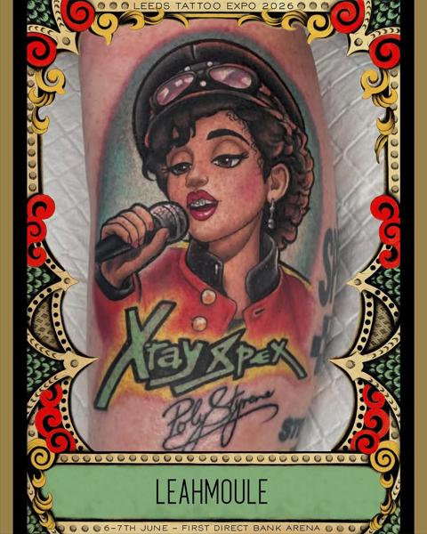 Realism singer portrait tattoo by @leahmoule