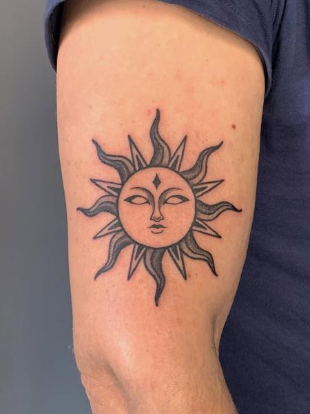 Blackwork celestial sun tattoo by @deyatatts