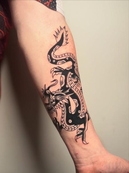 Traditional mythical serpent tattoo by @leeregantattoo