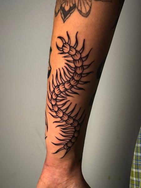 Blackwork centipede tattoo by @leeregantattoo