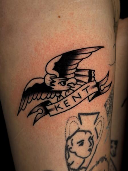 Traditional eagle banner tattoo by @leeregantattoo