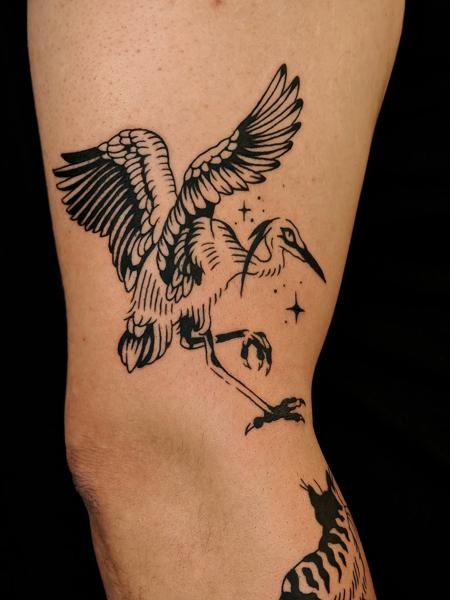 Blackwork flying crane tattoo by @fabrikatattooaesthetica