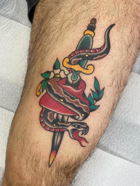 Traditional snake dagger tattoo by @no.karate.in.the.pit