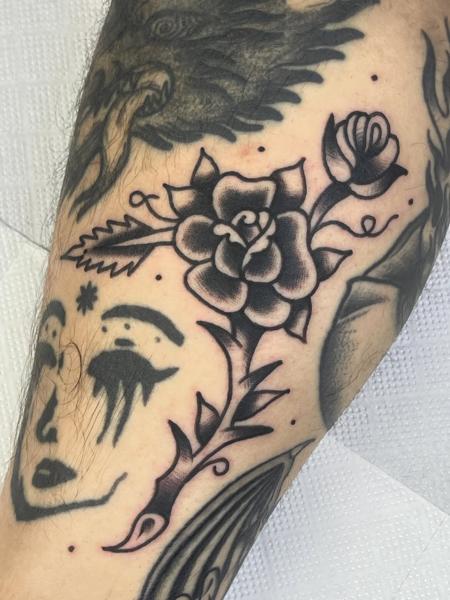 Traditional rose tattoo by @no.karate.in.the.pit