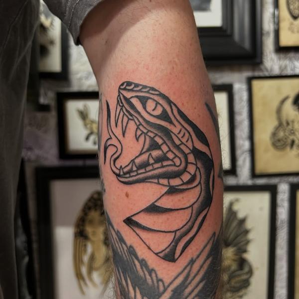 Traditional traditional snake tattoo by @ashestattoo