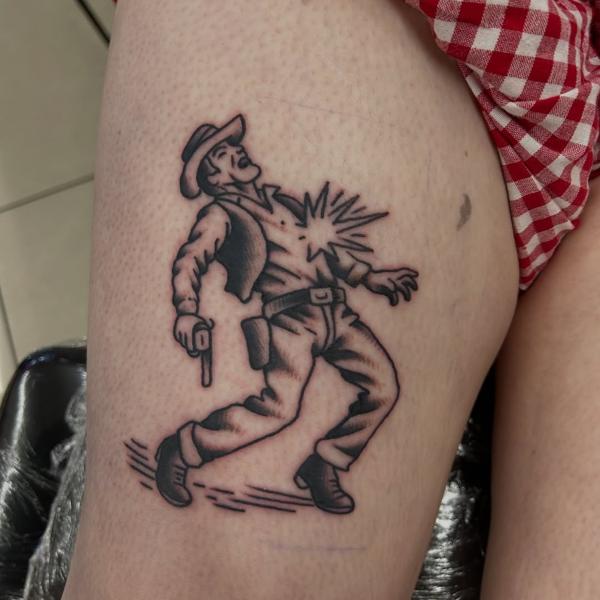 Traditional shot cowboy tattoo by @ashestattoo