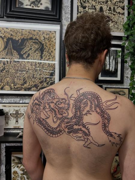 Japanese traditional fighting dragons tattoo by @ashestattoo