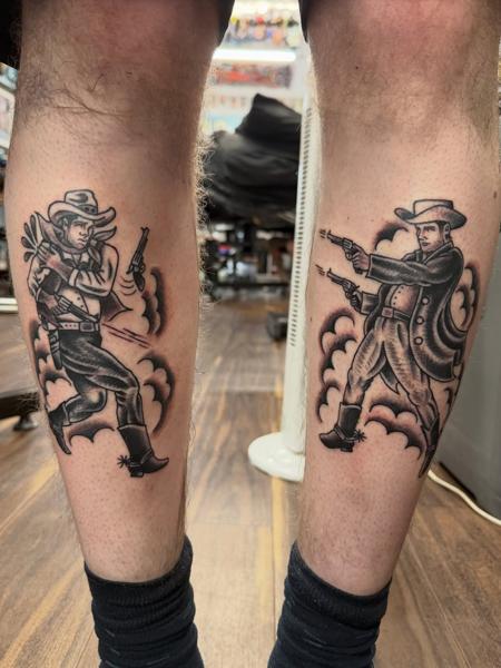 Traditional cowboy duel tattoo by @shedwolf
