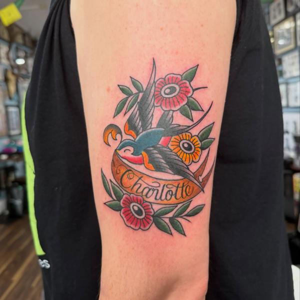 Traditional swallow and flowers tattoo by @shedwolf