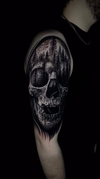 Realism forest skull tattoo by @ozkotattooart