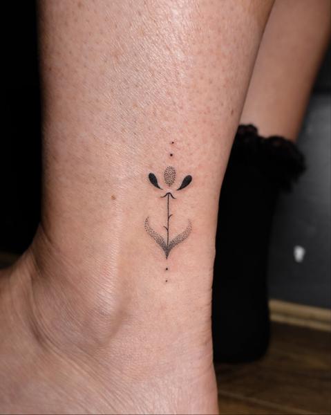 Fine line minimalist flower tattoo by @libertyctattoo