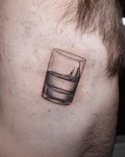 Realism water glass tattoo by @libertyctattoo
