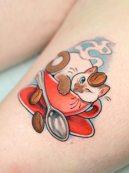 Illustrative cat in cup tattoo by @linkachuu.tattoo
