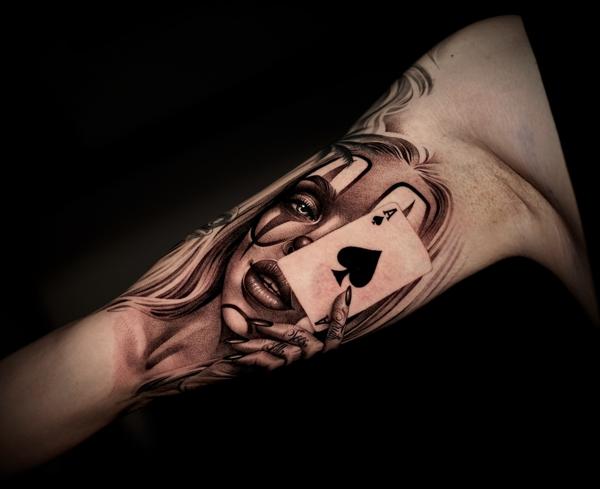 Realism woman with ace card tattoo by @lisa__ink
