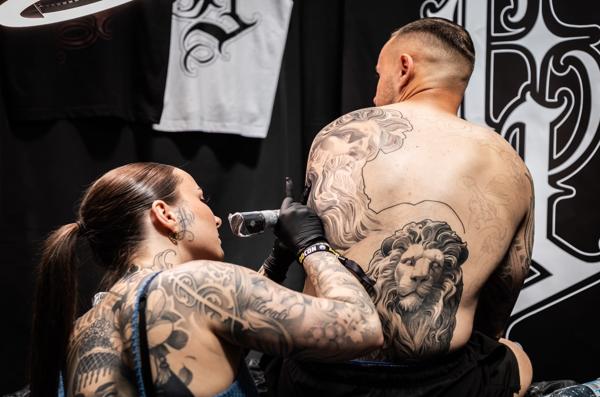 Realism lion and figure tattoo by @lisa__ink