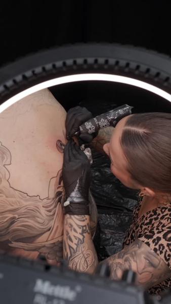 Realism angel wings tattoo by @lisa__ink
