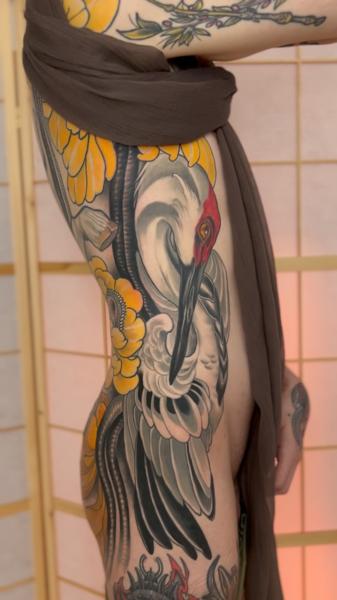 Japanese crane and flowers tattoo by @lore.morato