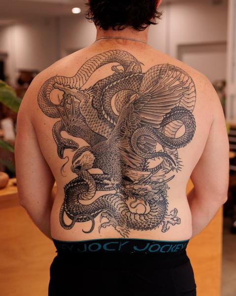Japanese eagle dragon tattoo by @lozzarachtattooer