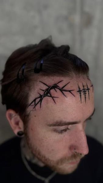 Blackwork thorn crown tattoo by @loz_tattooer