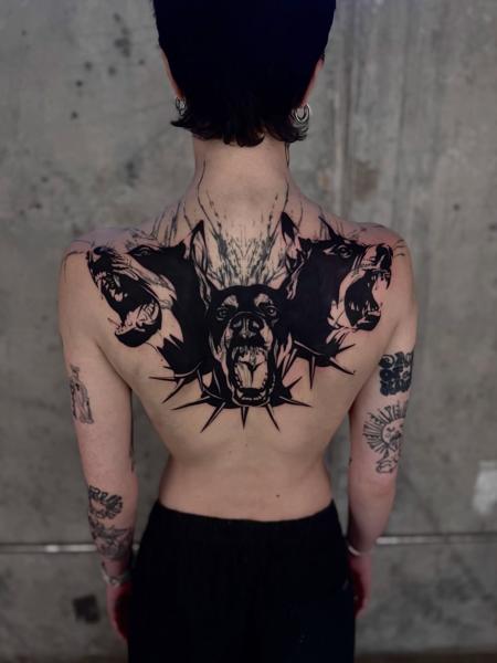 Blackwork aggressive doberman tattoo by @loz_tattooer