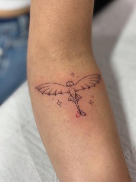 Fine line cartoon dragon tattoo by @lucie.tattoo