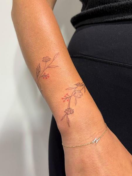 Fine line floral vine tattoo by @lucie.tattoo