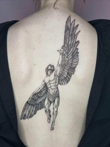 Illustrative winged figure tattoo by @lucky_lou_tattoos