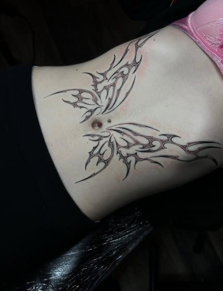Tribal tribal butterfly tattoo by @lucysaffrontattoo