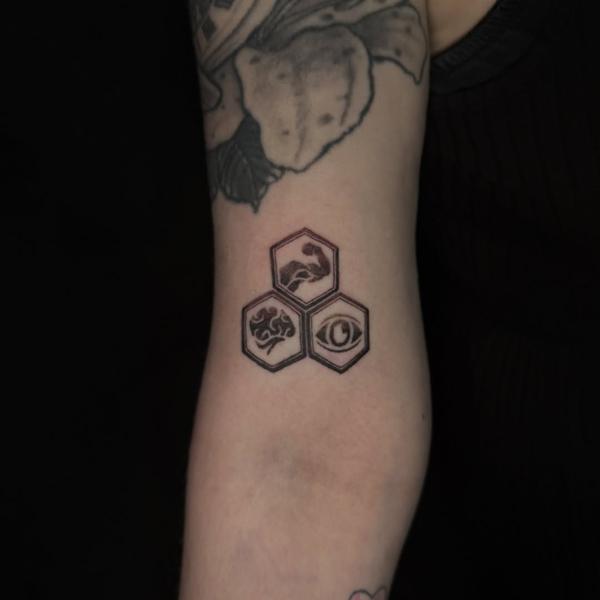 Geometric hexagonal symbols tattoo by @luisjtattoos