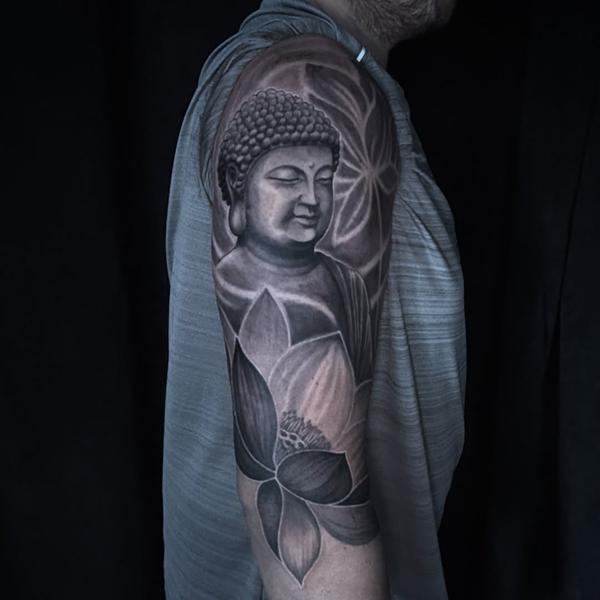 Realism buddha and lotus tattoo by @luisjtattoos