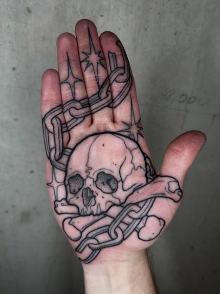Blackwork skull and chains tattoo by @lukeaashley