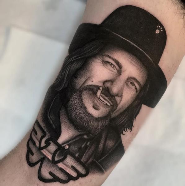 Realism smiling man portrait tattoo by @lunalucerotattoo