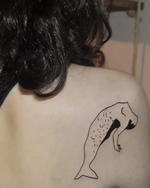 Fine line whale figure tattoo by @tatts_n_tonic