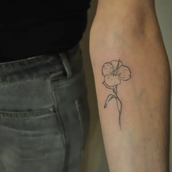 Fine line delicate flower tattoo by @tatts_n_tonic
