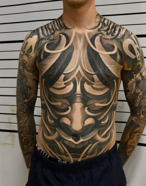 Dark ornamental abstract mask tattoo by @mads.flugt