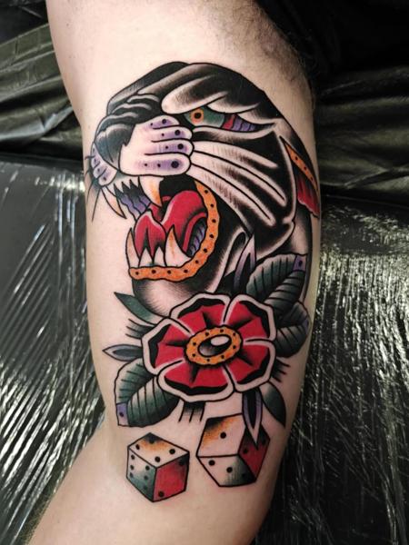 Traditional panther flower dice tattoo by @mads.flugt