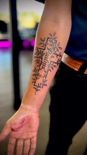 Linework cross with leaves tattoo by @maebeautifulpoison