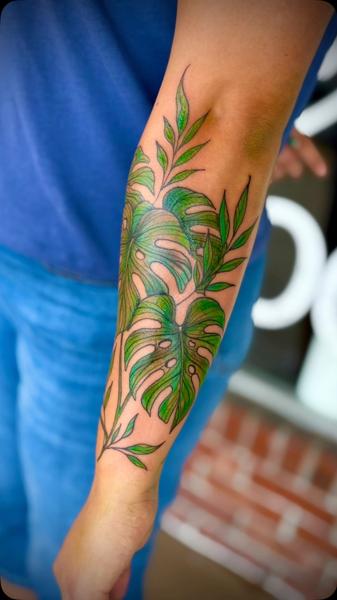 Color Realism monstera leaves tattoo by @maebeautifulpoison