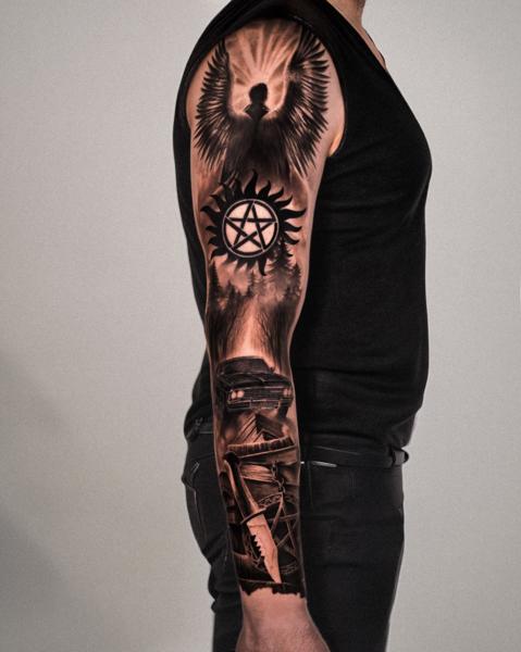 Realism angel and symbols tattoo by @magetower.tattoo