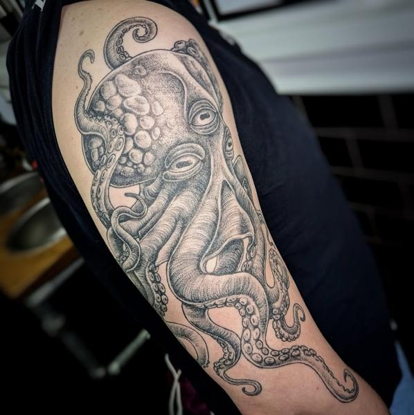 Blackwork octopus tattoo by @maisie.llewellyn