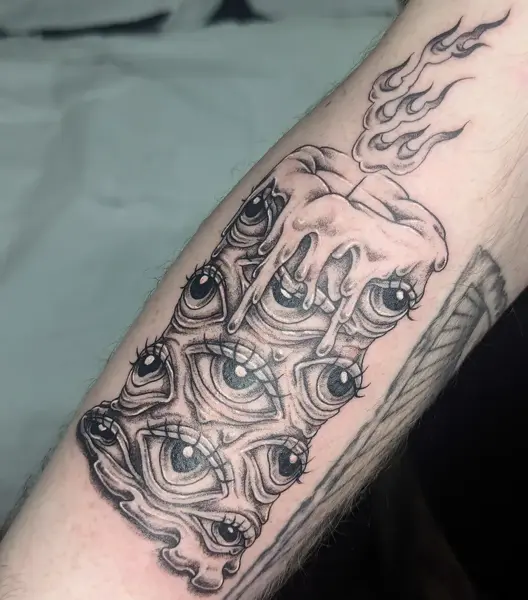 Blackwork melting candle tattoo by @maisie.llewellyn