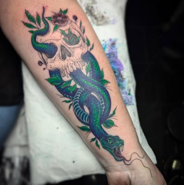 Traditional snake and skull tattoo by @maisie.llewellyn