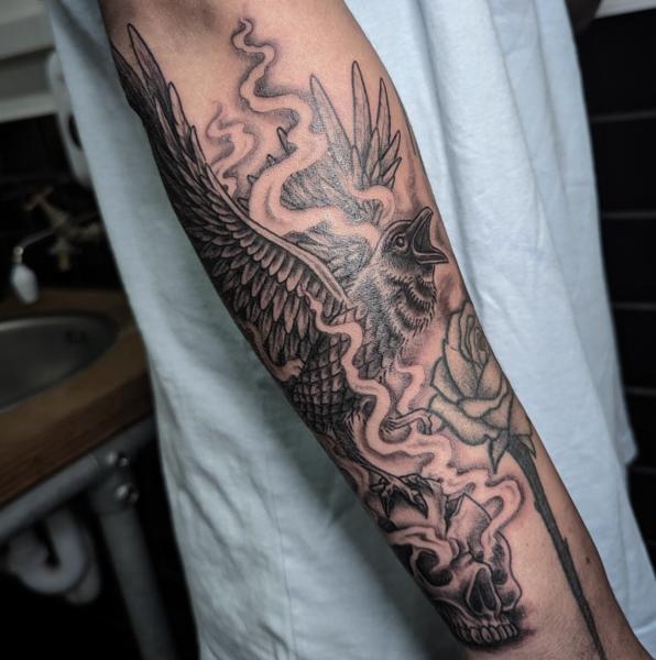 Blackwork bird and skull tattoo by @maisie.llewellyn